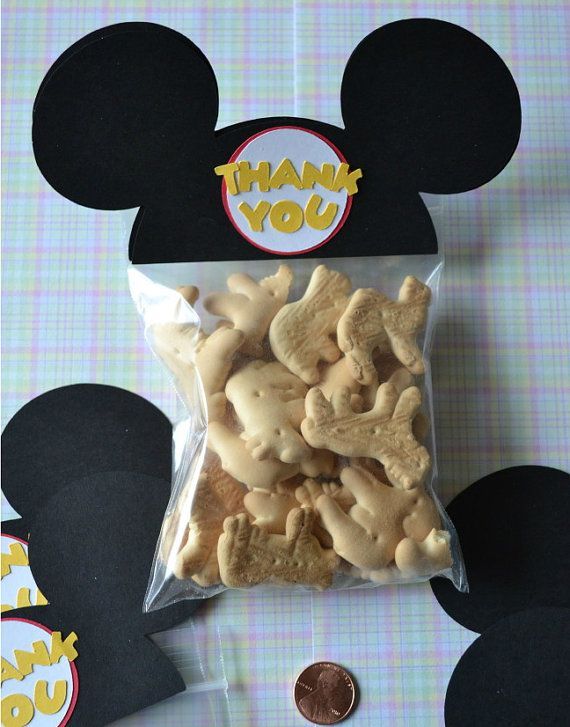 a mickey mouse treat bag filled with cookies