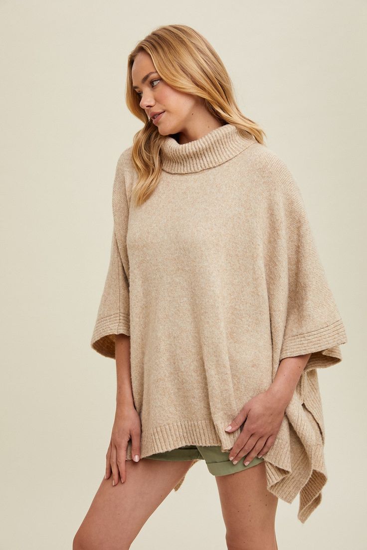 Stay cozy and stylish with our High Neck Sweater Poncho. Designed for maximum comfort and warmth, this poncho is perfect for those chilly days. Don't sacrifice fashion for function - our poncho combines both in one cozy package. The perfect addition to any wardrobe! Product Details: One Size Side Slits Cozy Soft Knit Poncho For Fall, Cozy Poncho For Cold Weather, Cozy Long Sleeve Cape For Cold Weather, Casual Solid Color Poncho For Fall, One Size Soft Knit Poncho For Fall, Cozy Knit Poncho For Fall, Oversized Winter Poncho For Loungewear, Cozy Winter Cape Poncho, Beige Poncho For Layering