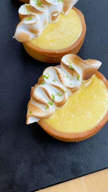 two small desserts are sitting on a table