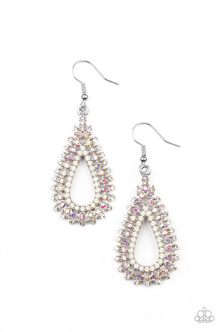 Glittery rows of white, iridescent, and opal rhinestones stack into a solitaire sparkly teardrop frame for a glamorous fashion. Earring attaches to a standard fishhook fitting. Sold as one pair of earrings. 1/12/2022 Paparazzi Advertising, Paparazzi Accessories Jewelry, Glamorous Fashion, Multicolor Earrings, Oil Spill, Stacked Earrings, Purple Rhinestone, Fish Hook Earrings, Paparazzi Accessories