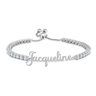 Timeless elegance made just for you!Your name is elegantly personalized on this stunning bracelet!Sparkling with 38 stunning simulated diamonds totaling over 6.5 carats. Beautifully presented, your bracelet will arrive in our signature keepsake pouch. Personalized Silver Cubic Zirconia Jewelry, Elegant Personalized Name Bracelet As Gift, Elegant Personalized Sterling Silver Name Bracelet, Elegant Customizable Bracelets As Personalized Gifts, Elegant Customizable Bracelets For Personalized Gifts, Personalized White Gold Jewelry With Diamond Accents, Elegant Named Cubic Zirconia Jewelry, Personalized Silver Jewelry With Diamond Accents, Elegant Custom Name Adjustable Jewelry