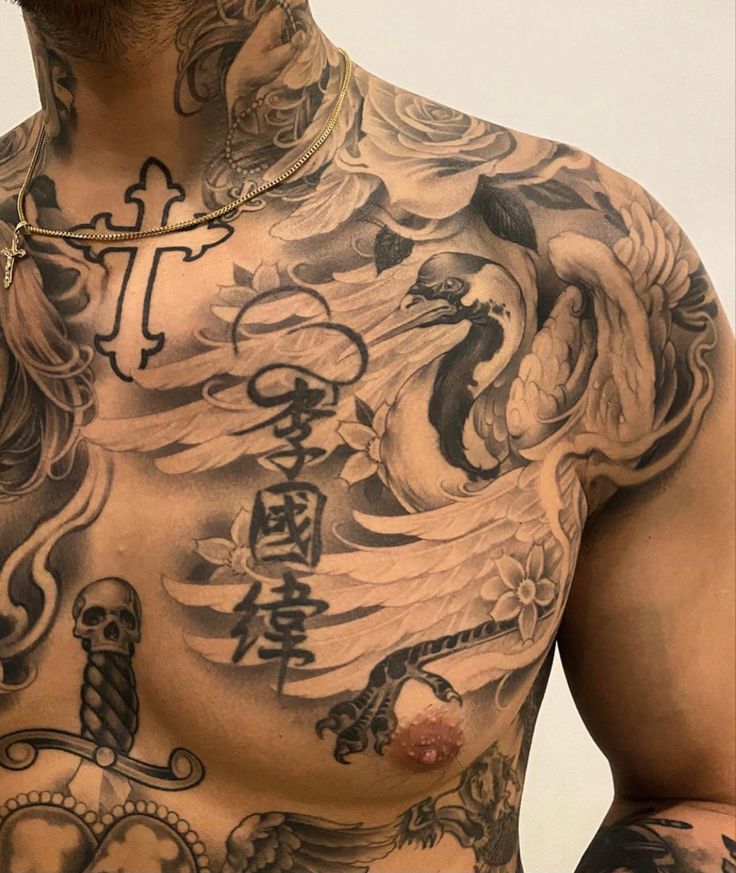 a man with lots of tattoos on his chest