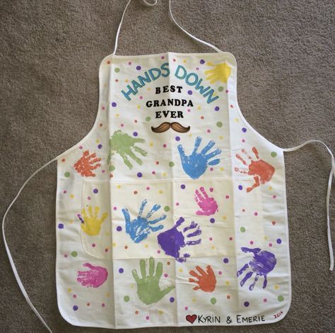 a child's apron with handprints on it