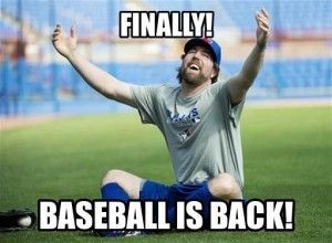 a man sitting on the ground with his arms in the air and hands up, saying finally baseball is back