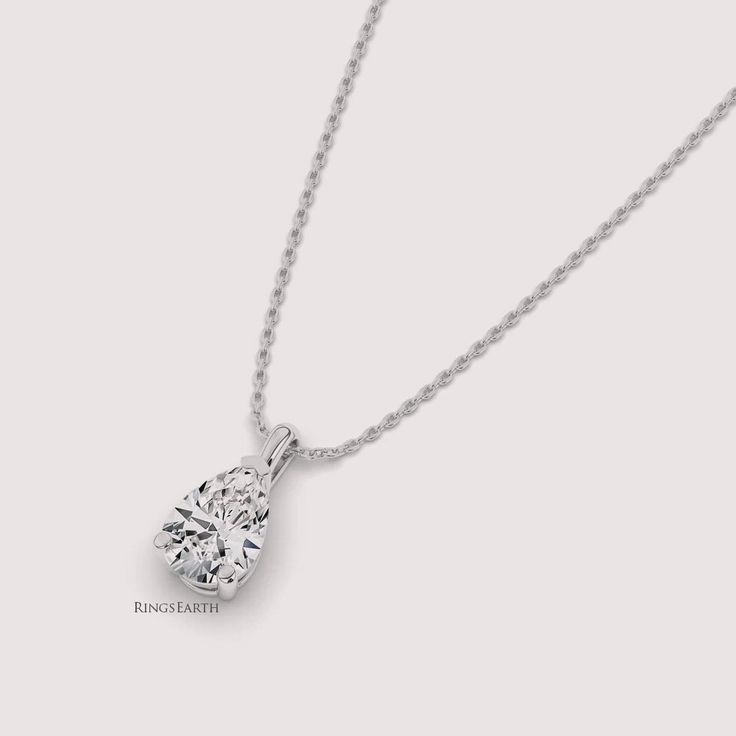 Elevate your style with our Lab Grown 1 Carat Pear Solitaire Diamond Pendant, expertly crafted in radiant 14K white gold. This exquisite pendant features a dazzling pear-cut lab-grown diamond, exuding timeless beauty and sophistication. Perfect for any occasion, this pendant adds a touch of elegance and glamour to your look. ✤𝐃𝐢𝐚𝐦𝐨𝐧𝐝 𝐃𝐞𝐭𝐚𝐢𝐥𝐬 Color: F Clarity: VS1 Shape: Pear Cut Carat Weight: 1 CT Approx. Type: Lab Diamond ✤Metal 𝐃𝐞𝐭𝐚𝐢𝐥𝐬 Metal Purity: Solid 14K Gold Metal Tone: Yellow, White, Rose Stamp/Hallmark: Yes Jewelry Certificate: Free of Cost with Listed Design Chain Length: 16″ inch Diamond White Pear-shaped Solitaire Necklace, Classic Solitaire Teardrop Pendant Necklace With Prong Setting, White Gold Pear-shaped Cubic Zirconia Solitaire Necklace, White Gold Pear-shaped Solitaire Necklace With Prong Setting, Classic Diamond Cut Teardrop Diamond Necklace, Classic Pear Shaped Solitaire Necklace With Prong Setting, Classic Pear-shaped Cubic Zirconia Diamond Necklace, Classic Pear-shaped Solitaire Necklace With Prong Setting, Classic Pear Shaped Diamond Cut Jewelry