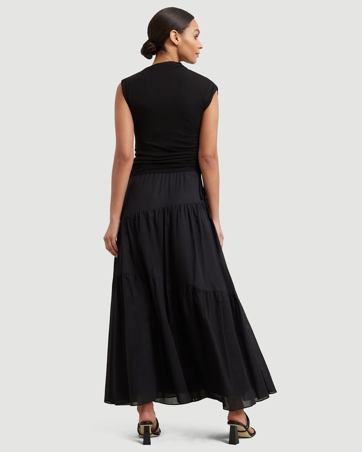 A tiered maxi skirt is a true staple of chic yet laid-back summer style — the Runa is a breezy piece that will make every outfit feel vacation-ready. See below for our general Size Guide and available measurements Made of 100% cotton Machine wash cold and lay flat to dry Chic Tiered Maxi Skirt For Summer, Tiered Maxi Skirt For Summer Day Out, Chic Voluminous Tiered Maxi Skirt, Chic Tiered Voluminous Maxi Skirt, Relaxed Tiered Maxi Skirt For Vacation, Tiered Gathered Maxi Skirt For Summer, Tiered Maxi Skirt For Vacation With Relaxed Fit, Summer Tiered Maxi Skirt With Gathered Details, Tiered Maxi Skirt For Summer