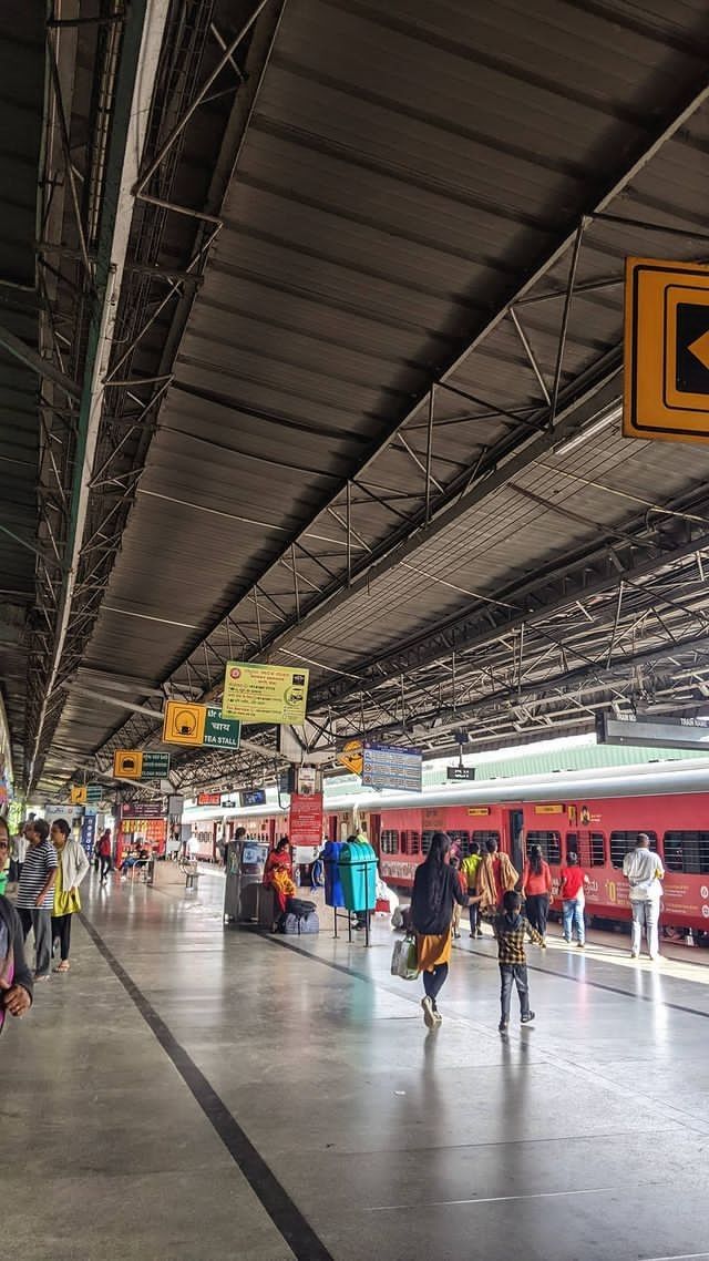 many people are walking around the train station