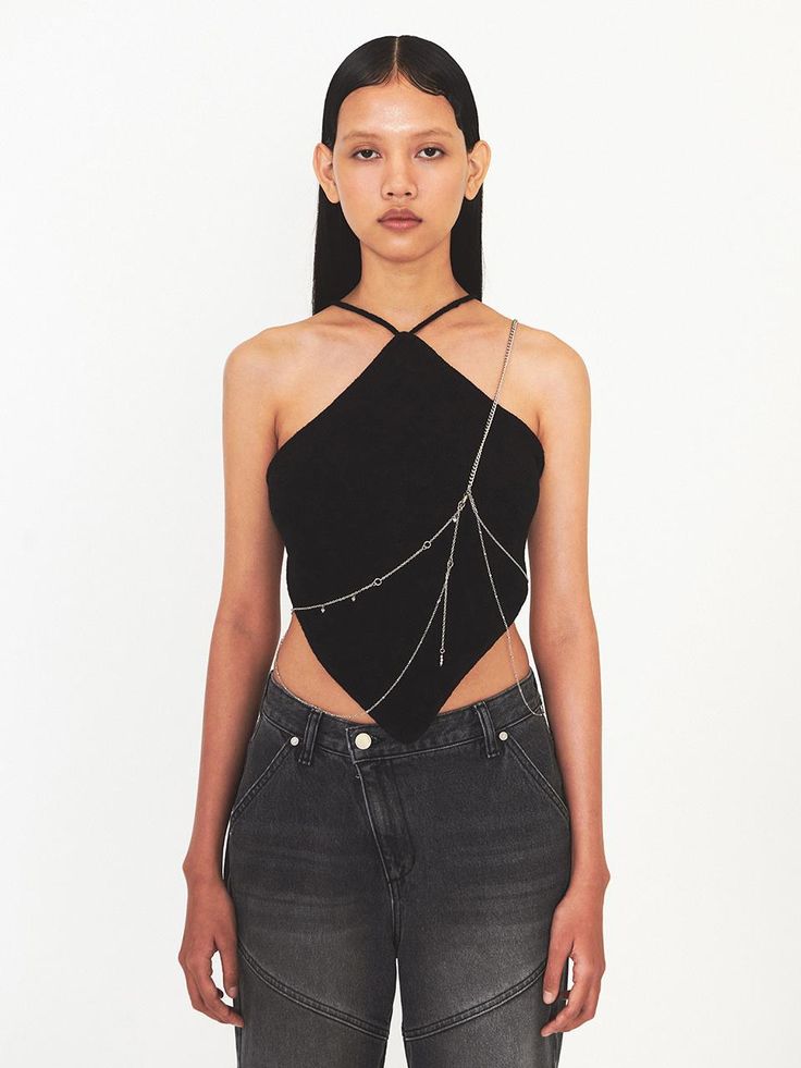 This is a modern and casual sleeveless top by DIAGONAL that is made out of high quality and sturdy fabric. With unique design detail and trendy mood, you can style it for your clean and casual daily outfit.- Diamond shape back opening- High air permeability- Strap on the neckline that can be styled in various ways Modern Black Crop Top For Summer, Trendy Black Vest Top, Trendy Stretch Halter Top Sleeveless Blouse, Trendy Stretch Sleeveless Halter Top, Edgy Cotton Party Top, Trendy Black Sleeveless Tops, Chic Cotton Tops For Evening, Chic Cotton Evening Tops, Chic Evening Cotton Tops