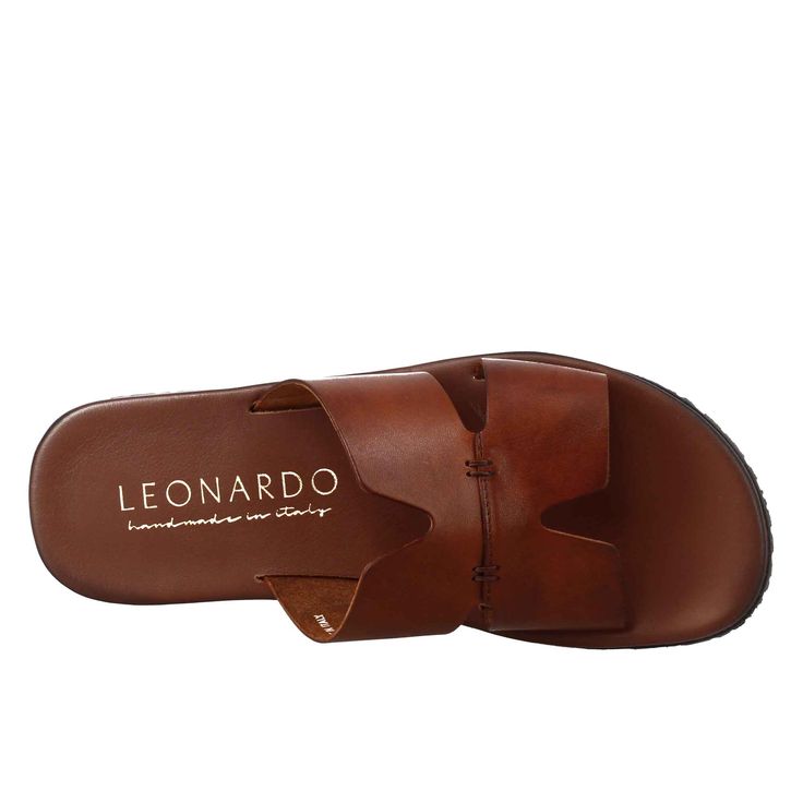 Men's H sandal



 Smooth tan vegetable tanned leather



 Rubber sole



 Padded insole



 Made in Italy




 Composition:
 Upper: 100% Leather 
Lining: 100% Leather
 Bottom: Rubber
 Insole: 100% Leather Brown Calf Leather Sandals With Leather Footbed, Brown Calf Leather Slides With Leather Footbed, Classic Brown Slides With Leather Sole, Brown Calf Leather Slides With Leather Lining, Brown Open Toe Slides In Calf Leather, Classic Brown Slides With Leather Lining, Brown Calf Leather Sandals With Cushioned Footbed, Brown Leather Lined Open Toe Slides, Brown Calf Leather Sandals With Leather Lining