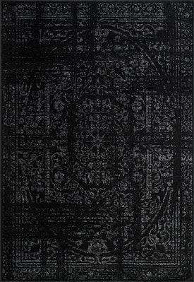 a black rug with an intricate design on it