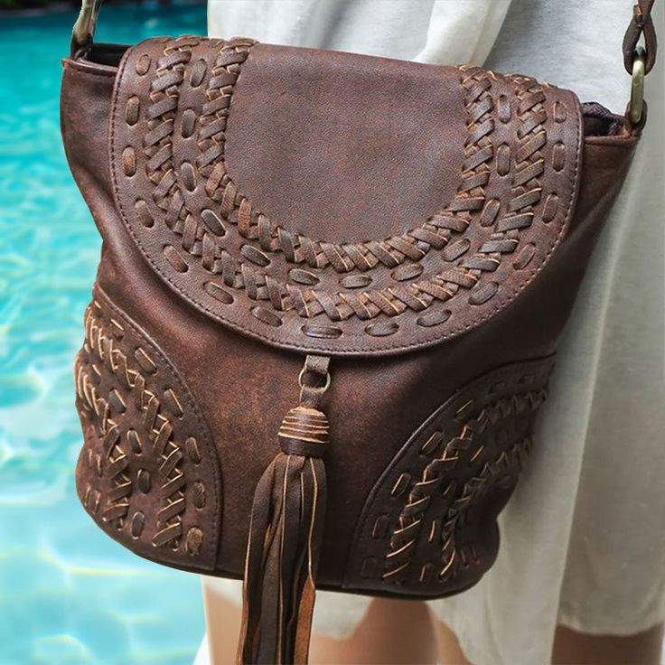 Looking for the perfect Boho handbag to take with you on all your adventures? Meet our stylish Boho Traveler Crossbody Bag! A jewel of artisan creation, this superb bohemian crossbody bag made of high-quality sheepskin leather features elegant hand-woven ornamental details for a genuine vintage bohemian feel and a Wild Boho vibe! ~ We love the stylish design of intricate handwoven patterns, the softness of genuine sheep leather and the long tassel on the flap, adding a touch of authenticity and Artisan Shoulder Bag With Braided Handles For Travel, Bohemian Woven Leather Bucket Bag For Daily Use, Artisan Bag With Adjustable Strap, Artisan Soft Leather Crossbody Satchel, Artisan Style Bag With Removable Pouch, Chic Shoulder Bag With Adjustable Strap For Festival, Leather Crossbody Shoulder Bag For Festivals, Leather Crossbody Satchel For Festival, Chic Festival Shoulder Bag