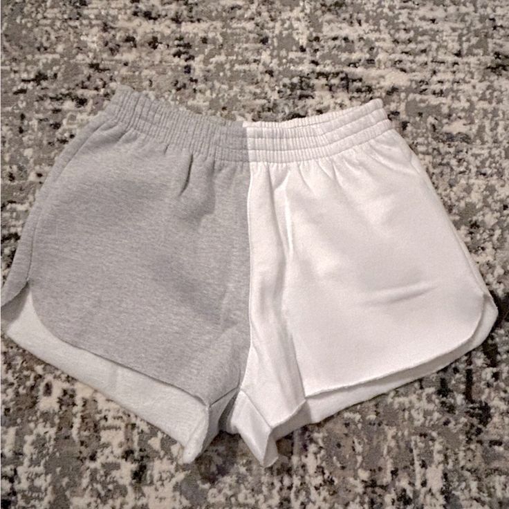 Half White And Half Gray Junior’s Shorts. New Without Tags. Size Small In Juniors. 80% Cotton , 20% Polyester. White Relaxed Fit Athletic Shorts For Spring, White Sporty Pajama Shorts With Relaxed Fit, White Sporty Relaxed Fit Pajama Shorts, Sporty White Relaxed Fit Pajama Shorts, Gray Athletic Shorts For Summer Loungewear, Trendy White Pajama Shorts For Beach, Sporty White Pajama Shorts, Casual White Athletic Shorts With Elastic Waistband, Gray Vacation Shorts