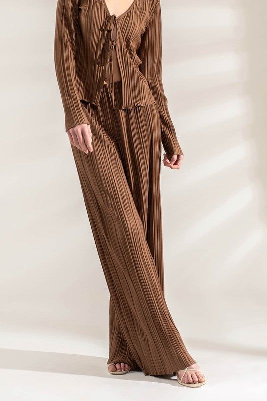 Brown Plisse Wide Leg Pants with Elastic Waistband. 100% Polyester Luxury Beige Wide Leg Pants With Elastic Waistband, Luxury Brown Wide Leg Pants For Women, Luxury Wide Leg Pants With Elastic Waistband, Luxury Spring Wide Leg Pants With Pleated Waist, Luxury Wide Leg Bottoms With Accordion Pleats, Luxury Brown Wide Leg Pants, Luxury Brown Chic Wide Leg Pants, Luxury Chic Brown Wide Leg Pants, Luxury Wide Leg Sets For Fall