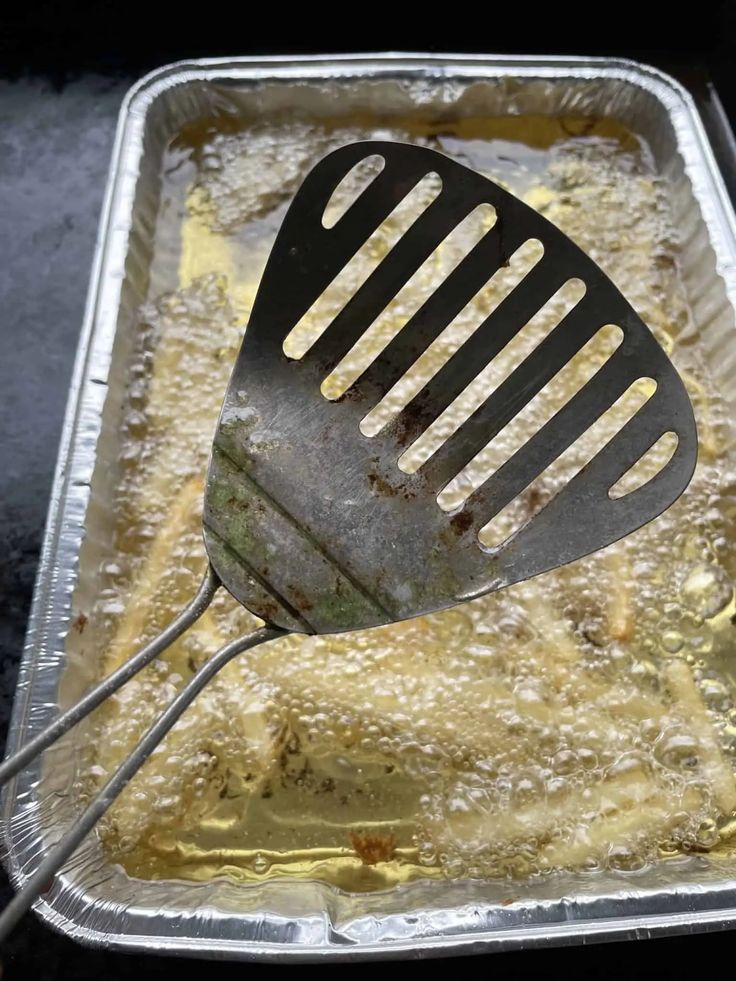 a spatula is being used to stir food in a pan