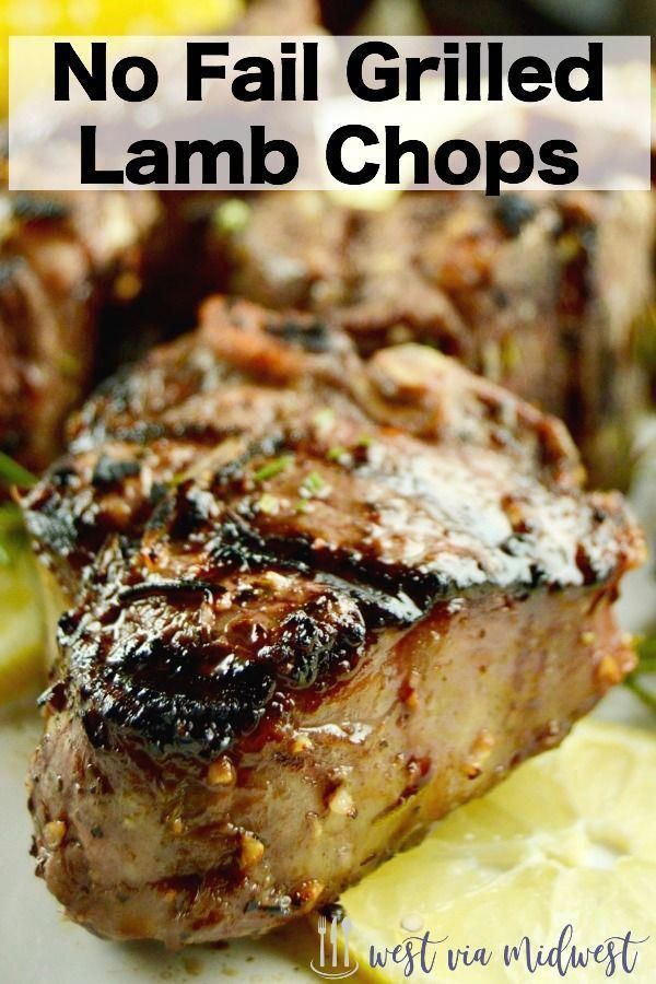 grilled lamb chops on a plate with lemon wedges