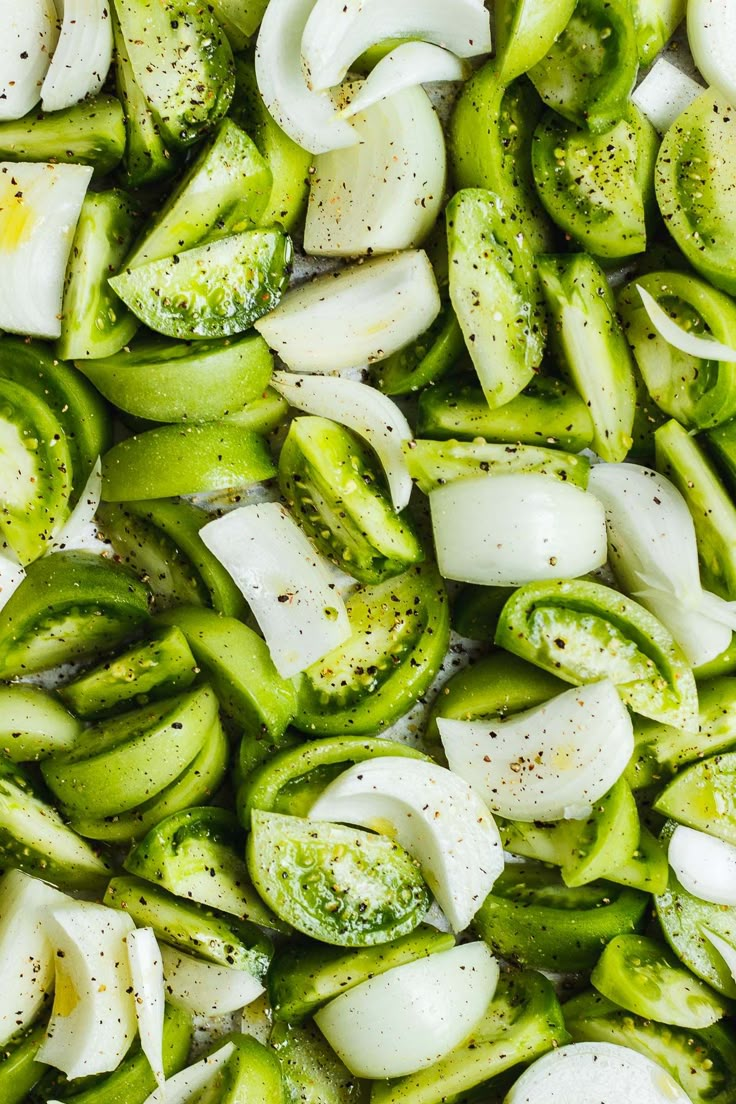 chopped green peppers and onions in a pan