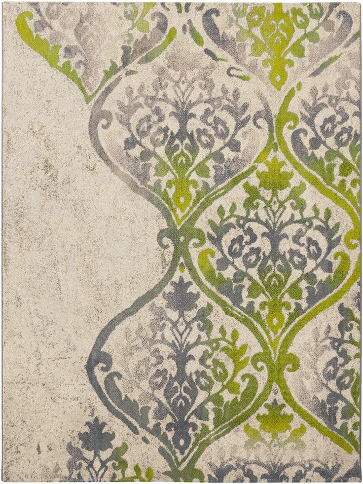 an area rug with green and gray designs on it