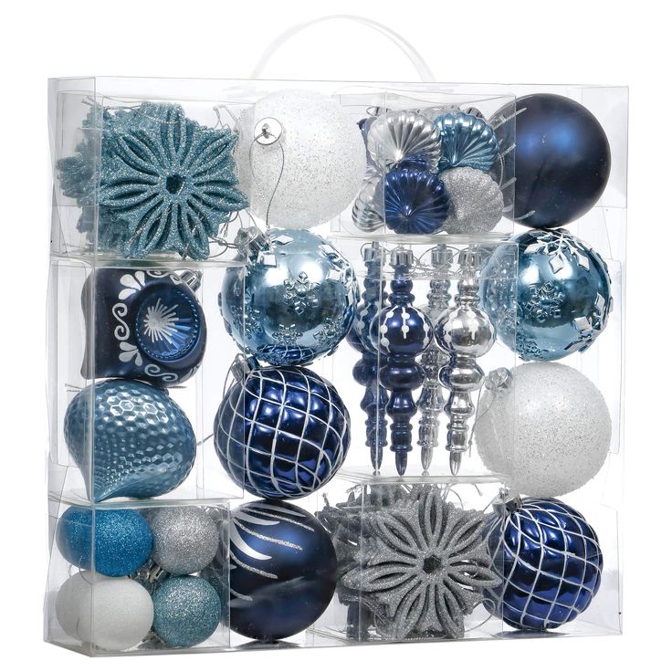 a clear box filled with blue and white ornaments