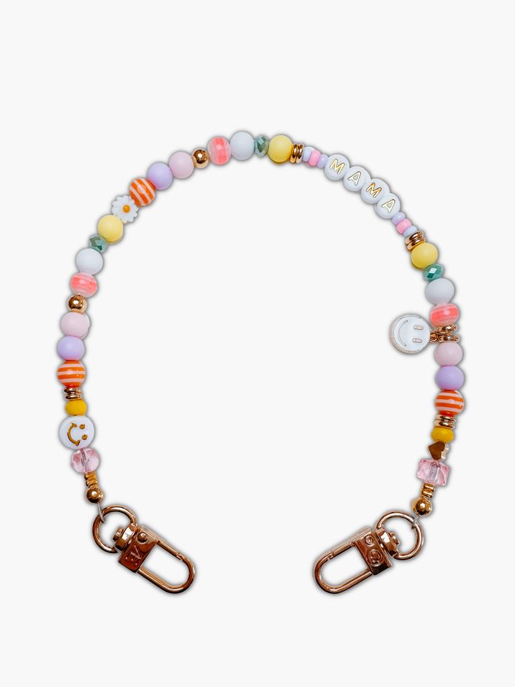 the beaded bracelet with charms is shown in multicolors and gold, on a white background