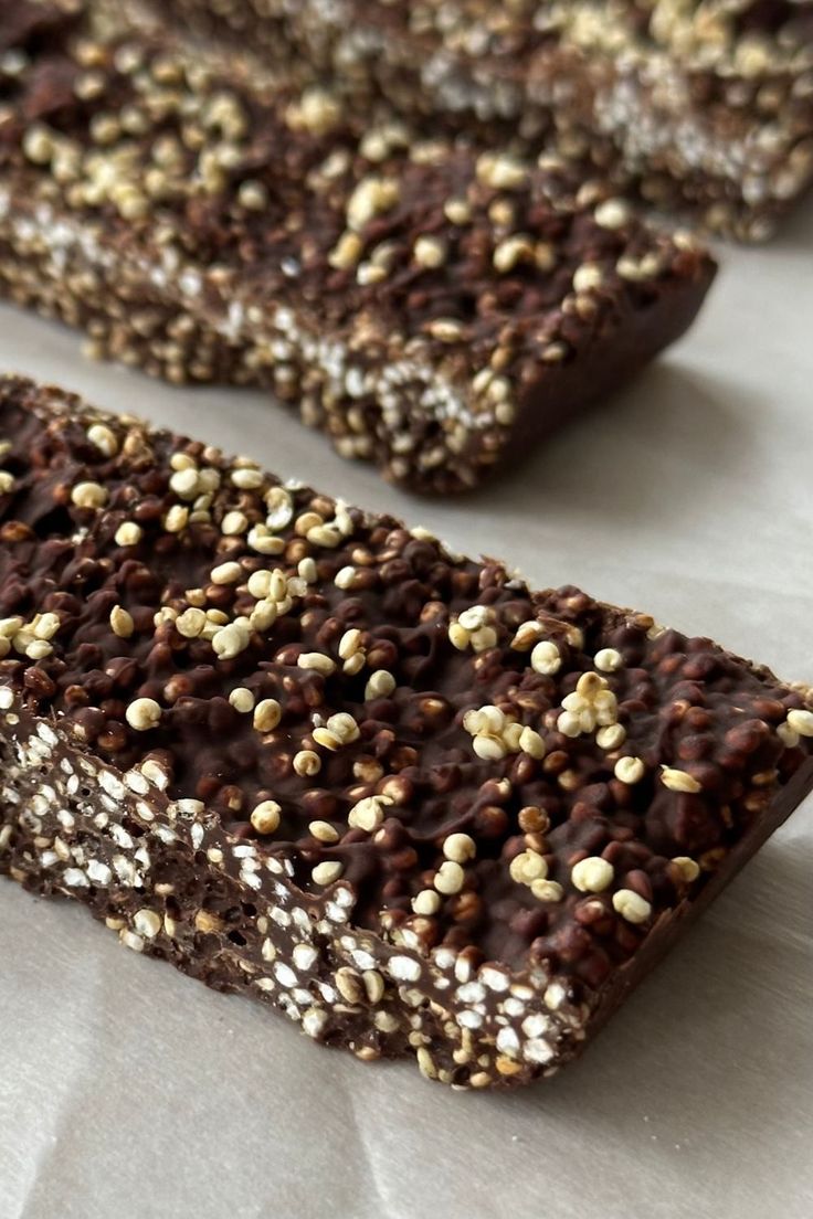 two chocolate bars with sprinkles on them sitting on top of a table