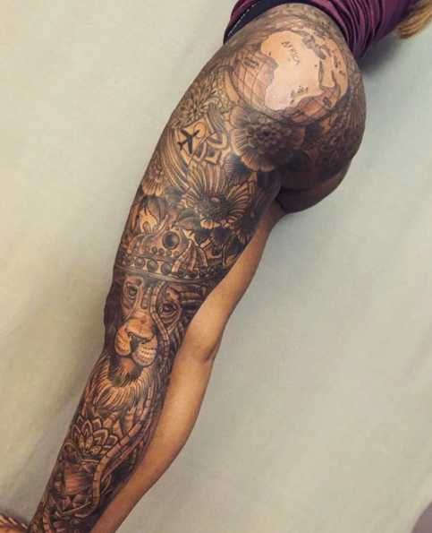 a man's arm with tattoos on it and a clock in the middle of his arm