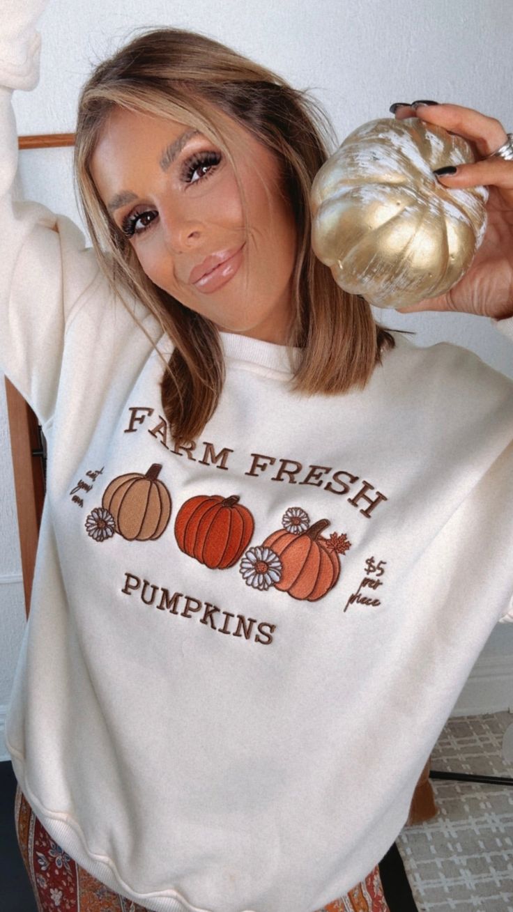 Embrace the fall vibes with our Farm Fresh Pumpkins Crewneck Sweatshirt - This cozy crewneck is crafted for comfort + style! The perfect addition to your fall wardrobe Farm Fresh Pumpkins Sweatshirt Crewneck Comfy + Cozy 68% Cotton, 32% Polyester Measurements: Measured lying flat XS: Sizing: (0/3) | Length: 26” S: Sizing: (4/6)| Length: 26 1/2” M: Sizing: (8/10) | Length: 27” L: Sizing: (12/14) | Length: 27 1/2” Model Specs: Karli is wearing a size small in the photo.How will this item fit you? Check out our MODEL SPECS (Typical Sizing - Karli: S-Size 5/26 - 5ft 2in, Emily: S-Size 3/25 - 5ft 5in, Syd: L/XL- Size 15/ - 5ft 8in)Need help with sizing? No problem! Join our VIP group on Facebook, Everyday Chic Boutique VIP Insiders to chat directly with our team and other customers just like yo Fall Loungewear T-shirt, Fall Crew Neck Sweater With Graphic Print, Fall Graphic Print Crew Neck Sweater, Trendy Fall Crew Sweatshirt, Trendy Crew Sweatshirt For Fall, Trendy Crew Neck Sweatshirt For Fall, Trendy White Sweatshirt For Fall, Oversized Crew Neck T-shirt For Fall, Cozy White Fall Sweatshirt