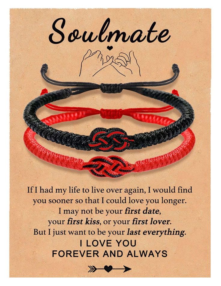 two red and black bracelets with the words soulmate written on it, in front of