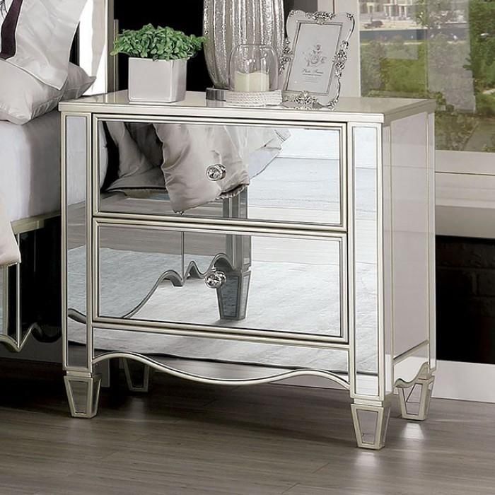 a mirrored night stand with two drawers and a plant on top in front of a window