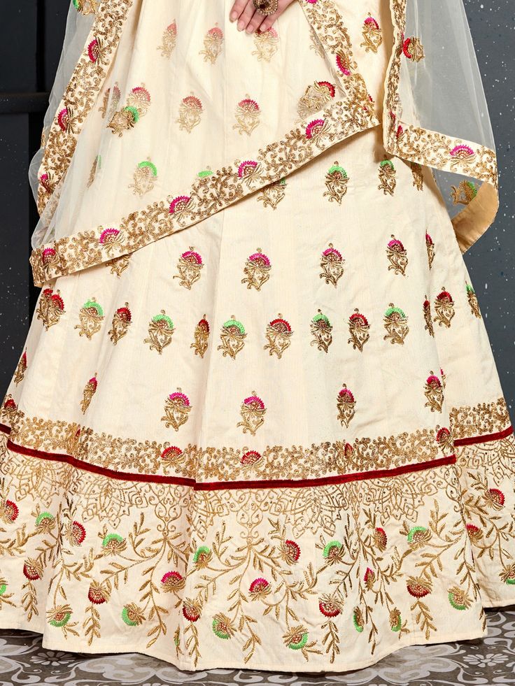 <ul>
<li style="text-align: justify;"><span style="text-align: justify;">Look gorgeous in this <a href="https://magento-991442-3511837.cloudwaysapps.com/lehenga-choli/filter/color-cream">cream color bridal ethnic designer lehenga</a> in slub silk designed with Thread, Dori, Zari Embroidery Work all over enhanced by stonework embellishments.</span></li>
<li style="text-align: justify;"><span style="text-align: justify;">Comes along with a matc Party Cream Choli With Intricate Embroidery, Embroidered Off-white Wedding Choli, Cream Embroidered Lehenga For Wedding, Embroidered Cream Lehenga Unstitched, Cream Embroidered Wedding Choli, Silk Bridal Lehenga, Dori Work, Zari Embroidery, Designer Lehenga