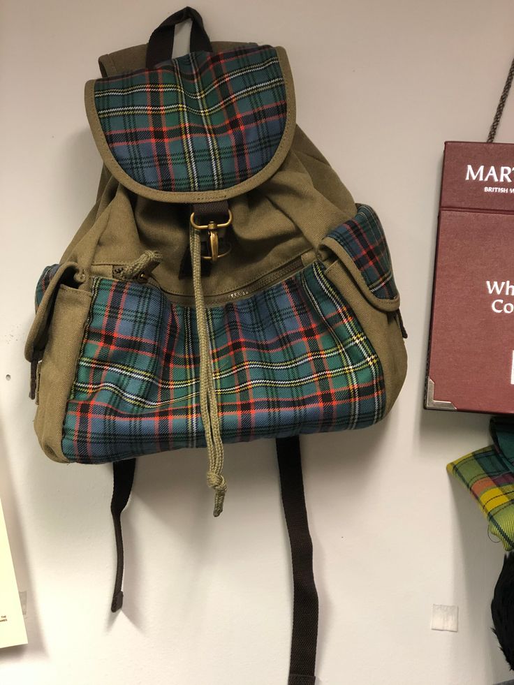 This tartan and canvas rucsac is the perfect accessory for those who love to embrace their Scottish heritage in style. Handcrafted with care, this rucsac is made with your choice of tartan, using heavyweight 100% wool tartan woven in Scotland. With a wide range of colors available, you can choose the canvas that best complements your chosen tartan. Whether you prefer the earthy tones of Olive Green and Sand, or the classic appeal of Black and Navy, we've got you covered. Designed with both funct Tartan Design, Visit Scotland, Scottish Heritage, Kilt, Canvas Material, Black And Navy, In Style, Tartan, Olive Green