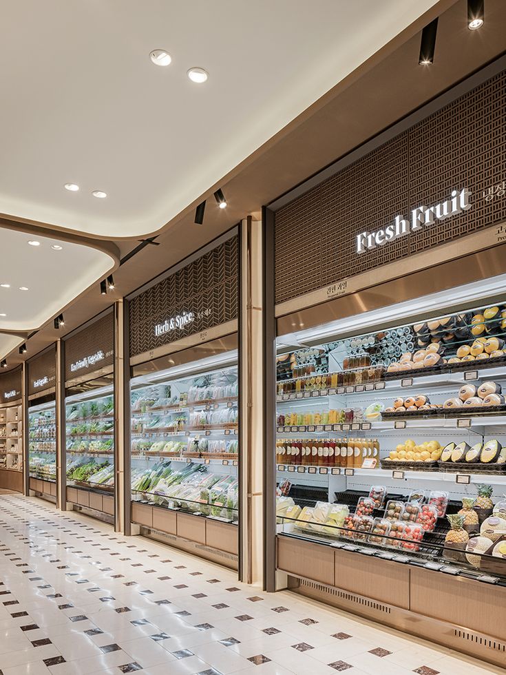 the inside of a grocery store filled with lots of fresh food and drinks on display