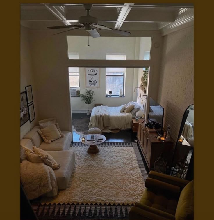 a living room filled with furniture and a flat screen tv