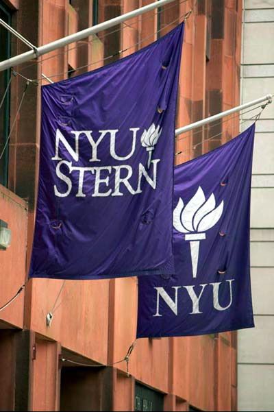 two purple banners hanging from the side of a building next to another sign that says nyu stern