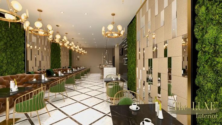 the interior of a restaurant with green walls and white tiled flooring, along with tables and chairs