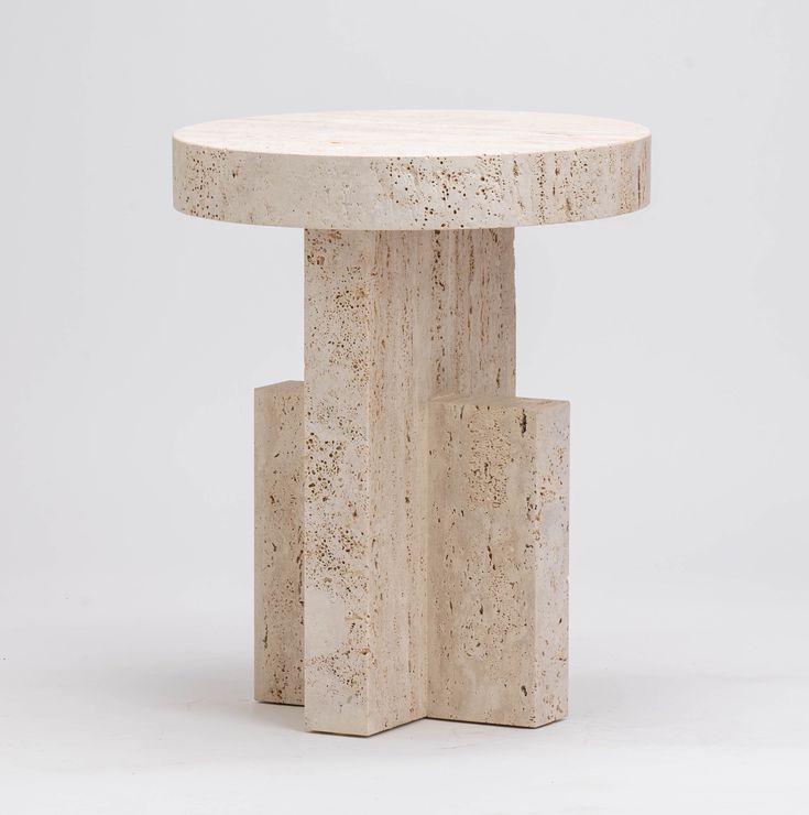 a round table with two small blocks on it's sides and a white background