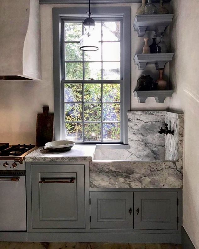 the instagram page shows an image of a kitchen with gray cabinets and marble counter tops