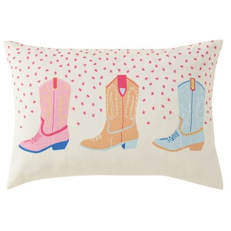 a pillow with three cowboy boots on it