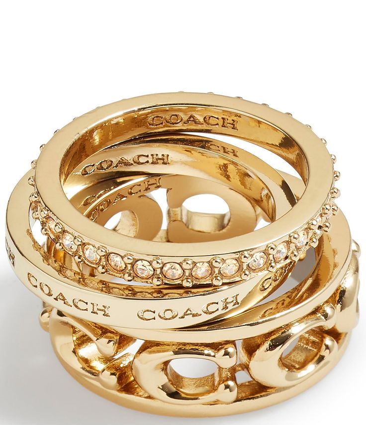 From COACH, this ring set features:Band ring setBrass/Glass CrystalSlip-on Signature sculpted C motif, engraved logo, and minimal paveApprox. 0.1" - 0.3" ring face lengthApprox. 2mm - 8mm ring band widthApprox. 17mm ring band diameterSet includes 3 rings to mix and matchIncludes COACH pouchImported. Dope Jewelry Accessories, Luxe Jewelry, Jewelry Accessories Ideas, Dope Jewelry, Girly Accessories, Jewelry Fashion Trends, Jewelry Essentials, Stacked Jewelry, Jewelry Lookbook