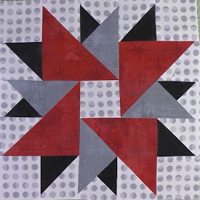 a red, black and grey star quilt