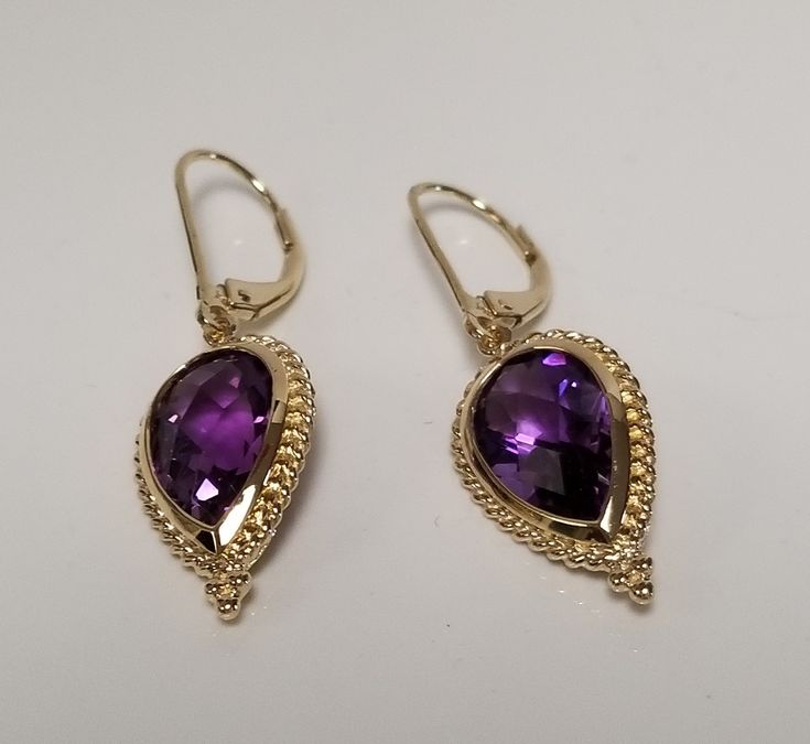 "Thanks for shopping our vintage estate store. We tend to sell well below wholesale and truly hope you enjoy all of our items. Many of the items are one of a kind, so please enjoy scrolling through the pictures and hopefully something will catch your eye. Spots are from camera or reflections. Beautiful estate 14k yellow gold natural 8ct purple amethyst emerald cushion cut tear drop dangle vintage lever back earrings. Gem testing natural and should be natural, 4ct or more per earring. Length: 1.5\" Gem: 11mm by 7mm Width: 3/4\" Weight: 3.92 grams Marked 14k and testing to be 14k, stunning, some that you will love." Classic Pear-shaped Purple Jewelry, Classic Purple Pear-shaped Jewelry, Unique Amethyst Teardrop Earrings, Yellow Gold Amethyst Teardrop Pendant Jewelry, Yellow Gold Amethyst Teardrop Earrings, Teardrop Faceted Amethyst Jewelry, Teardrop Multi-stone Amethyst Earrings, Beautiful Anklet, Gold Sun