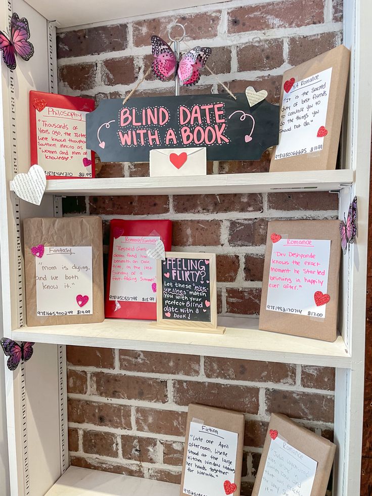 a book shelf filled with lots of different types of cards and paper on top of it