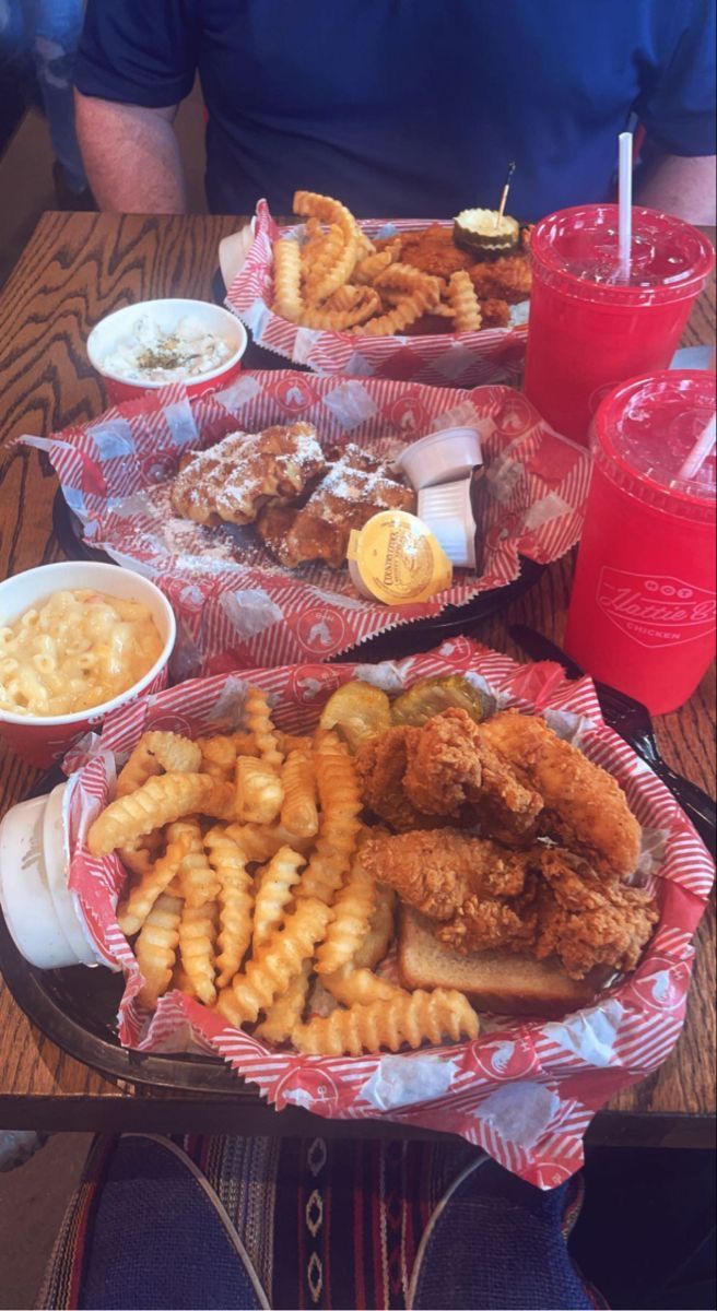 a table topped with plates of food and drinks