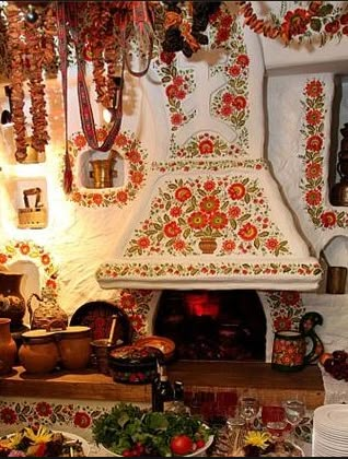 a stove top oven sitting inside of a kitchen filled with lots of cooking utensils