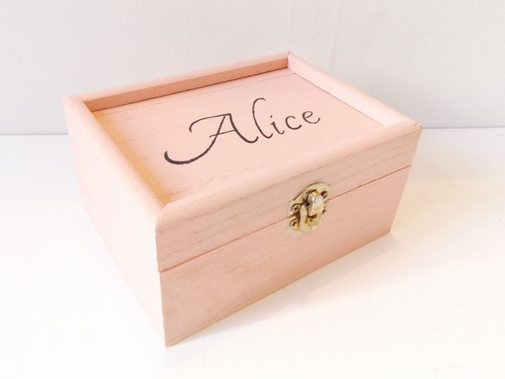 a wooden box with the word alice written on it