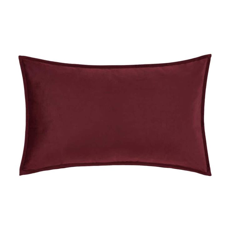 an image of a maroon pillow on a white background