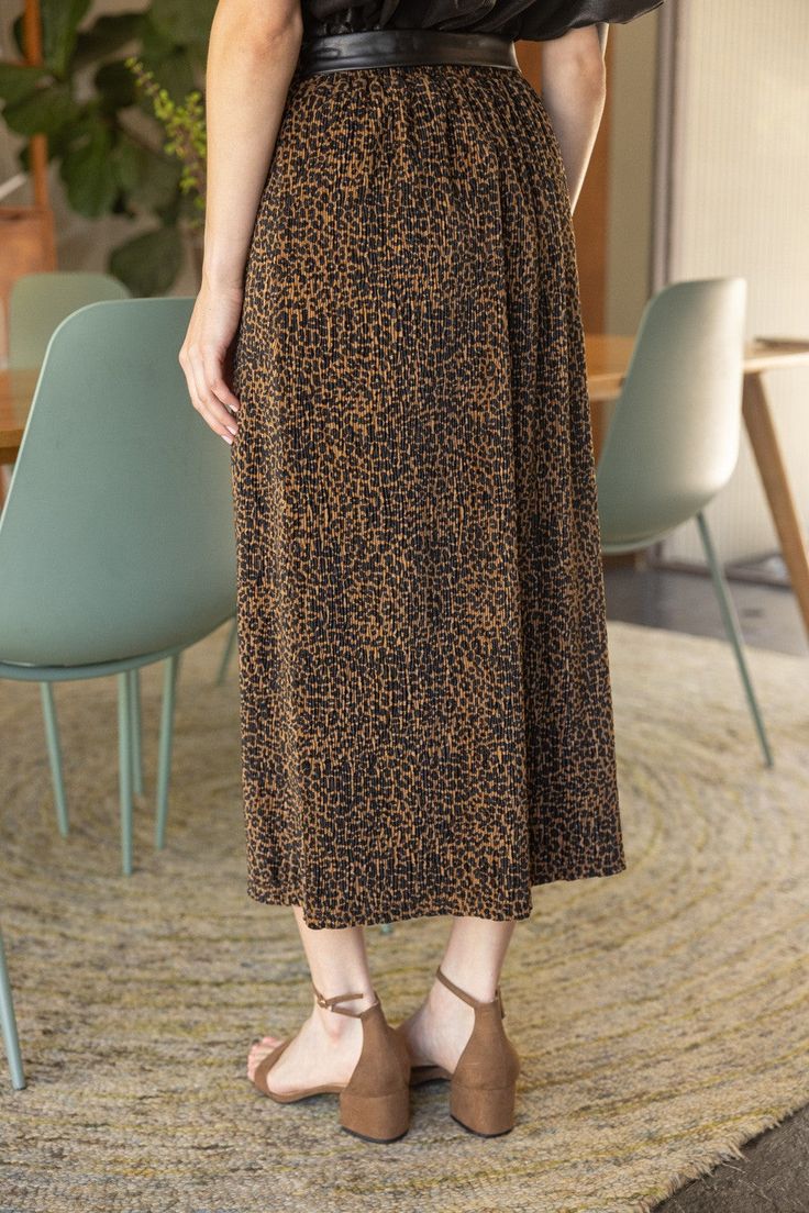 Unleash your wild side with our Samantha Leopard Velvet Midi Skirt. This stunning skirt features a bold leopard print and chic faux leather belt that add a touch of edginess to any outfit. The textured velvet material gives the skirt a luxurious feel, while the midi length adds a sophisticated touch. Shop now and add a touch of fierce elegance to your wardrobe with our Samantha Leopard Velvet Midi Skirt. Leopard Print Skirt Textured Velvet Midi Length Faux Leather Belt Elastic Waistband 95% Poly Velvet Midi Skirt, Midi Skirt Outfit, Leopard Print Skirt, Faux Leather Belts, Velvet Material, Print Skirt, Skirt Outfits, Leather Belt, Midi Length