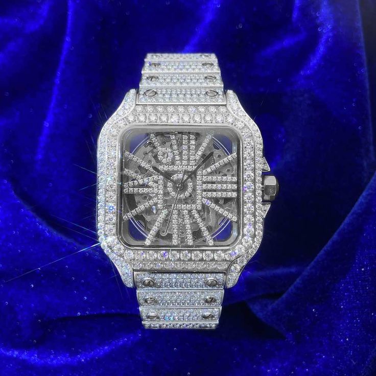 ICECARTEL exclusive Bust Down Moissanite Watch is now available, made of stainless steel and PVD plated with a thick layer of 14K White Gold. This moissanite watch is iced out with round, colorless (D-Color), VVS moissanite flawless diamonds. All of the diamonds on this skeleton watch are guaranteed to pass the diamond tester. This mechanical moissanite watch features a self-winding mechanism that gets Its energy from the natural motion of the wearer (mainspring).Every watch comes in a universal Timeless Round Iced Out Diamond Watch, Silver Elegant Iced Out Diamond Watch, Classic Silver Iced Out Diamond Watch, Moissanite Watch, Luxury Iced-out White Gold Diamond Watch, Timeless Iced-out Diamond Watch, Custom Jewelry Box, Diamond Tester, Flawless Diamond