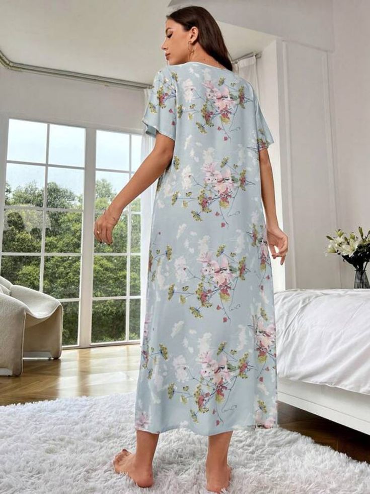 Experience the beauty of nature with our Floral Print Nightdress. Embrace comfort in its regular fit and indulge in the softness of 100% Viscose. Drift into serenity with its non-stretch fabric, while the short sleeves and long length add a touch of elegance. Suitable for machine washing or professional dry cleaning, this sleep shirt is a blend of style and ease. Elevate your sleepwear collection with the enchanting allure of florals. Features: Pattern Type: Floral Type: Sleepshirts Sleeve Lengt Floral Print Short Sleeve Nightgown For Sleepover, Short Sleeve Floral Print Sleep Dresses, Short Sleeve Floral Sleep Dresses, Spring Floral Print Short Sleeve Nightgown, Floral Print Short Sleeve Nightgown For Loungewear, Short Sleeve Floral Print Nightgown For Loungewear, Short Sleeve Nightgown With Floral Print For Loungewear, Blue Short Sleeve Sleepwear For Night, Short Sleeve Floral Print Dress For Loungewear