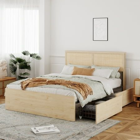 a large bed sitting on top of a wooden floor