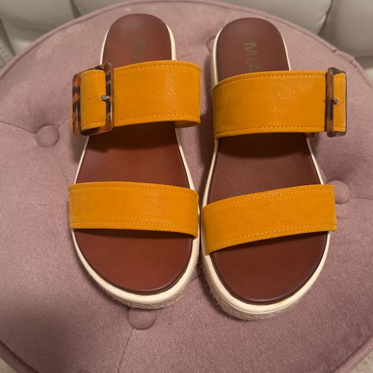 Never Worn Yellow Flat Platform Sandals, Yellow Leather Sandals With Removable Insole, Yellow Closed Toe Sandals, Casual Yellow Leather Sandals, Trendy Yellow Open Toe Wedge Sandals, Yellow Open Toe Sandals For Spring, Orange Sandals With Buckle Closure For Vacation, Yellow Synthetic Sandals For Summer, Orange Buckle Closure Sandals For Vacation